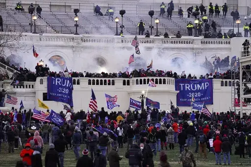 Violent protesters, loyal to President Donald Trump, storm the Capitol, Wednesday, Jan. 6, 2021, in Washington. (AP Photo/John Minchillo, File)
