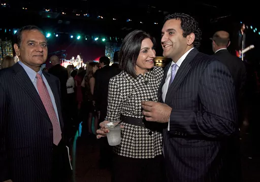In this Jan. 18, 2011 file photo, Dr. Love Paul, left, Pearl Paul, and their son Nate Paul, right, attend the 2011 Texas Inaugural Celebration at the Palmer Events Center in Austin, Texas. FBI agents on Thursday, June 8, 2023 arrested Nate Paul, a Texas businessman at the center of the scandal that led to the historic impeachment of state Attorney General Ken Paxton.(Laura Skelding/Austin American-Statesman via AP, File)