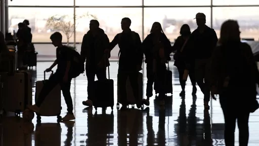 People pass through Salt Lake City International Airport Wednesday, Jan. 11, 2023, in Salt Lake City. Summer can be an expensive time to travel. Though it’s usually best to pay with cash for any nonessentials, like a vacation, there are financing options available if you don’t have the funds to cover your travel expenses outright. (AP Photo/Rick Bowmer, File)