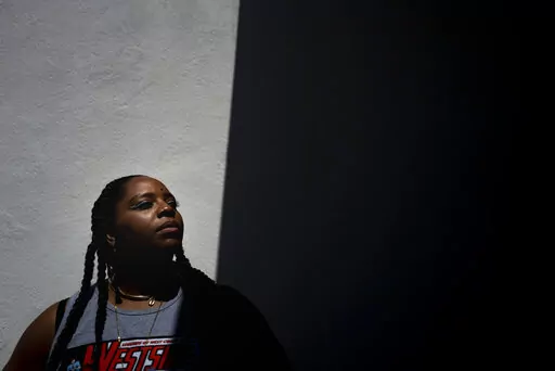 Black Lives Matter co-founder Patrisse Cullors stands for a photo at Crenshaw Dairy Mart, an art gallery and studio space co-founded by Cullors, in Inglewood, Calif., Tuesday, April 19, 2022.