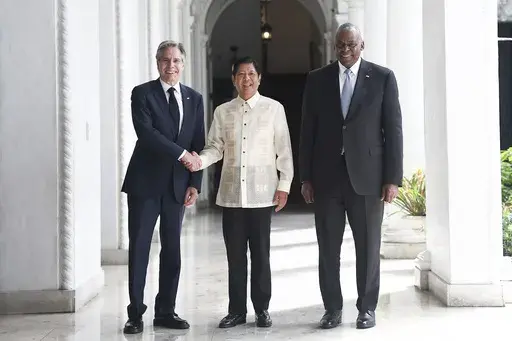 Philippine President Ferdinand Marcos Jr., center, greets U.S. Secretary of State Antony Blinken, left, and U.S. Secretary of Defense Lloyd Austin at the Malacanang presidential palace in Manila, Philippines on Tuesday, July 30, 2024. (AP Photo/Basilio Sepe, Pool)