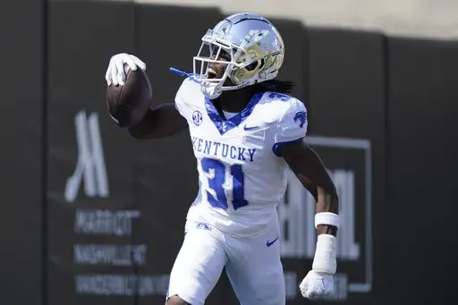 Kentucky defensive back Maxwell Hairston (31) celebrates his interception for a touchdown against Vanderbilt in the first half of an NCAA college football game Saturday, Sept. 23, 2023, in Nashville, Tenn. (AP Photo/George Walker IV, File)