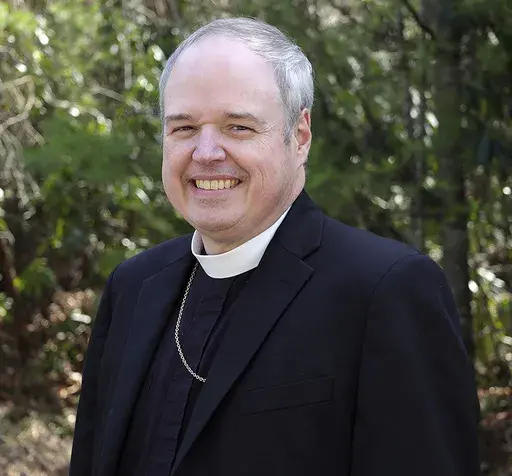 This image provided by The Episcopal Church shows Episcopal Diocese of Northwestern Pennsylvania Bishop Sean Rowe in his official 2024 church photo. (The Episcopal Church via AP)