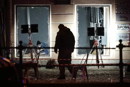 Russian investigators work at the site of an explosion at a cafe in St. Petersburg, Russia, Sunday, April 2, 2023. An explosion tore through a cafe in the Russian city of St. Petersburg on Sunday, and preliminary reports suggested a prominent military blogger was killed and more than a dozen people were injured. (AP Photo)