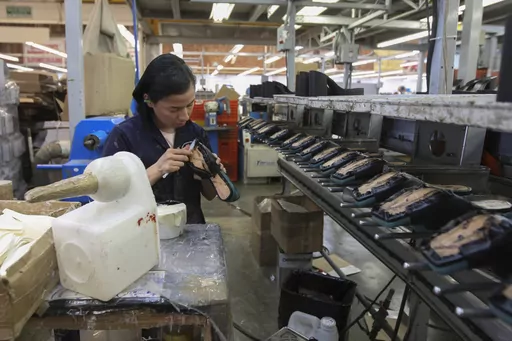 A woman works in a shoe maquiladora or factory in Leon, Mexico, Feb. 7, 2023. For the first time in more than two decades, Mexico last year overtook China as America's top supplier of goods — a shift that reflects political tensions between Washington and Beijing and U.S. efforts to import from countries that are friendlier and closer to home. (AP Photo/Mario Armas, File)