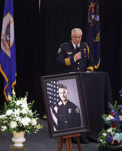 Fargo Police Chief David Zibolski speaks during funeral services for Fargo Police Officer Jake Wallin at Pequot Lakes High School in Pequot Lakes, Minn., on Saturday, July 22, 2023. Wallin, 23, was killed July 14 when a man armed with 1,800 rounds of ammunition, multiple guns and explosives ambushed officers responding to a routine traffic crash. (David Samson/Forum Communications Co. via AP, POOL)