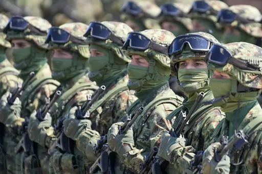 Serbian Army soldiers perform during a military exercise, at Batajnica Air Base near Belgrade, Serbia, on April 22, 2023. Serbia on Friday, June 23, 2023 reiterated the threat of an armed intervention in its former province of Kosovo, unless the NATO-led peacekeepers stationed there don't protect the minority Serbs there from "the great terror" of the Kosovo "regime." Serbian army chief-of-staff, Gen. Milan Mojsilovic, said that the military stands ready to fulfil its tasks "in accordance to the