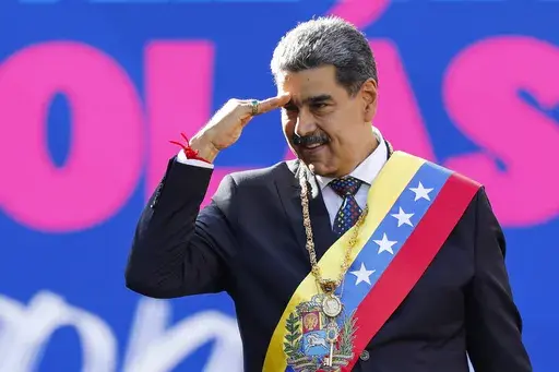 Venezuelan President Nicolas Maduro salutes supporters on his inauguration day for a third term at Miraflores presidential palace in Caracas, Venezuela, Jan. 10, 2025. (AP Photo/Cristian Hernandez)