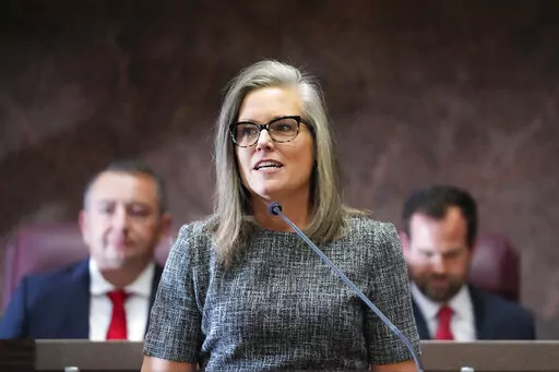 Democratic Arizona Gov. Katie Hobbs, middle, is flanked behind by Arizona House Speaker Ben Toma, R-Glendale, left, and Arizona Senate President Warren Petersen, R-Gilbert, right, at Hobbs' state of the state address at the Arizona Capitol in Phoenix on Jan. 9, 2023. On Friday, Jan. 20, 2023, Hobbs ordered a review of the procurement process for lethal injection drugs and other death penalty protocols due to the state's history of mismanaging executions. (AP Photo/Ross D. Franklin, File)