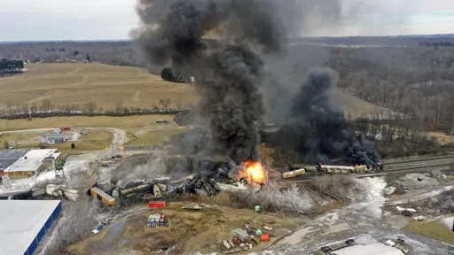 This photo taken with a drone shows portions of a Norfolk Southern freight train that derailed Friday night in East Palestine, Ohio are still on fire at mid-day Saturday, Feb. 4, 2023. Toxic wastewater used to extinguish a fire following a train derailment in Ohio is headed to a Houston suburb for disposal. Harris County Judge Lina Hidalgo says “firefighting water” from the East Palestine, Ohio train derailment is to be disposed of in the county and she is seeking more information.(AP Photo/