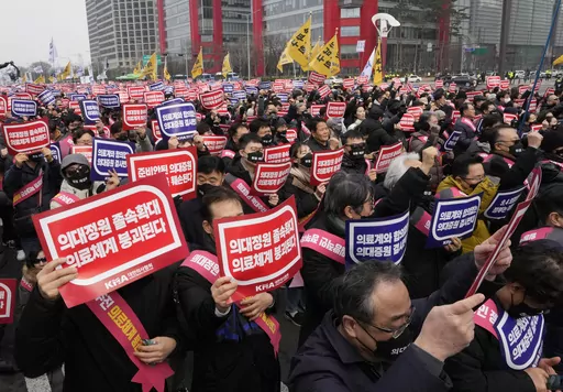 Doctors stage a rally against the government's medical policy in Seoul, South Korea, on March 3, 2024. South Korean authorities have suspended the licenses of two senior doctors for allegedly inciting the weekslong walkouts by medical interns and residents that disrupted hospital operations across the country. That's according to one of the doctors who spoke to The Associated Press. The suspensions are the government’s first punitive step against physicians after thousands of doctors-in-traini