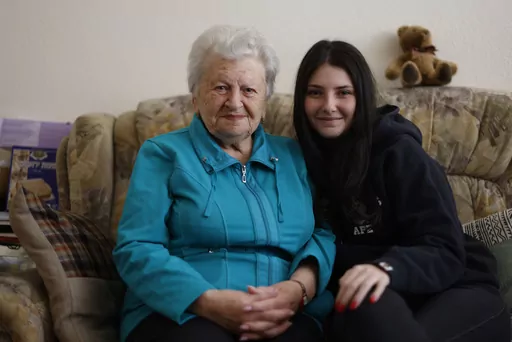 Holocaust survivor Assia Gorban, left, and her granddaughter Ruth Gorban pose during an interview with The Associated Press in Berlin, Germany, Monday, April 3, 2023. Assia Gorman and her granddaughter, 19-year-old Ruth Gorban, are taking part in the new digital campaign Our Holocaust Story: A Pledge to Remember. The campaign launched by the New York-based Conference on Jewish Material Claims Against Germany, also referred to as the Claims Conference, features survivors and their descendants fro