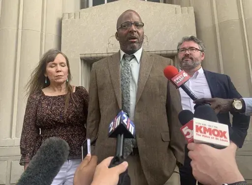 Christopher Dunn stands free after his murder conviction was overturned after 34 years behind bars, on the steps of a courthouse in downtown St. Louis, Tuesday, July 30, 2024. (Laurie Skrivan/St. Louis Post-Dispatch via AP)