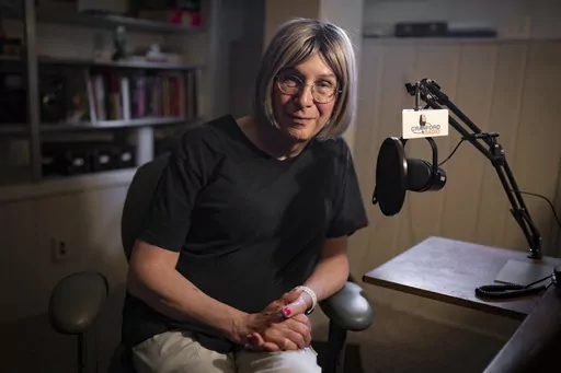 Bernie Wagenblast sits for a photo at her home, Friday, June 16, 2023, in Cranford, N.J. As culture wars erupt anew in the United States over sex and gender, Wagenblast is exchanging that voice for a new one, with a pitch and cadence that reflects a transition from being the man he was to the woman she is becoming. (AP Photo/John Minchillo)