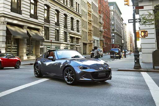 This photo provided by Mazda, shows the 2022 Mazda Miata MX-5 RF, a small rear-wheel-drive roadster with a retractable hardtop. (Courtesy of Mazda North American Operations via AP)