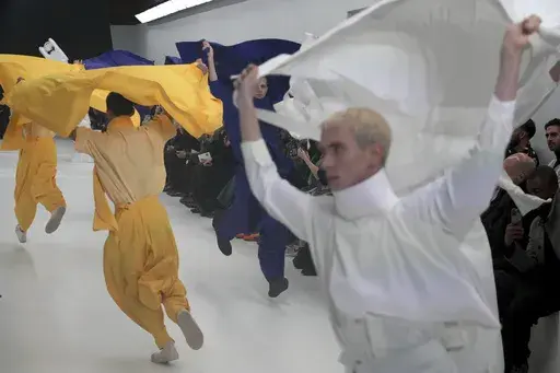 Models wear creations as part of the men's Issey Miyake Fall-Winter 2025-2026 collection, that was presented in Paris, Thursday, Jan. 23, 2025. (AP Photo/Michel Euler)