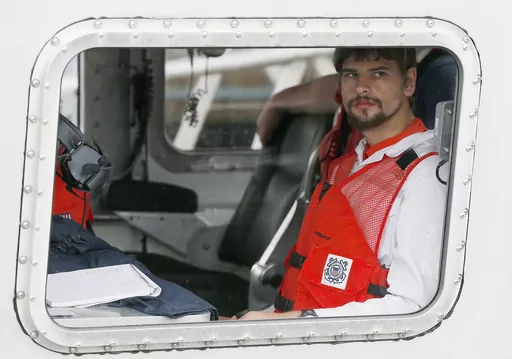 Nathan Carman arrives in a small boat at the U.S. Coast Guard station, in Boston, on Sept. 27, 2016. The man charged with killing his mother at sea during a 2016 fishing trip off the coast of New England in what prosecutors say was a scheme to inherit millions of dollars has died, federal authorities said Thursday, June 15, 2023. (AP Photo/Michael Dwyer, File)