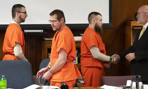 Paul Bellar, left, Pete Musico and Jospeh Morrison appear for sentencing in front of Jackson County Circuit Court Judge Thomas Wilson on Thursday, Dec. 15, 2022 in Jackson, Mich. Paul Bellar, Joseph Morrison and Pete Musico were accused of being involved in a plot to kidnap Michigan Gov. Gretchen Whitmer. The judge on Thursday handed down the longest prison terms so far in the plot to kidnap Michigan's governor, sentencing three men who forged an early alliance with a leader of the scheme before