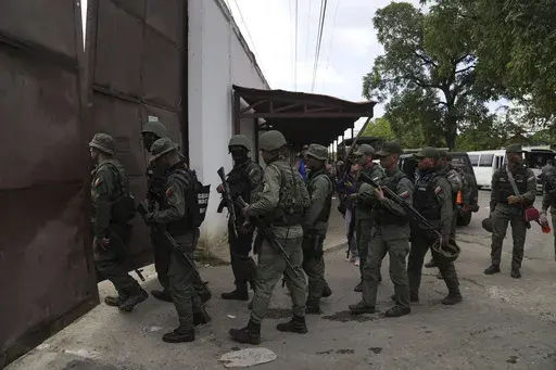 Soldiers raid the Tocorón Penitentiary Center, in Tocorón, Venezuela, Wednesday, Sept. 20, 2023. The Tren de Aragua gang originated at the prison. The Biden administration on Thursday, July 11, 2024, sanctioned the Venezuelan gang allegedly behind a spree of kidnappings, extortion and other violent crimes tied to migrants that have spread across Latin America and the United States. (AP Photo/Ariana Cubillos, File)